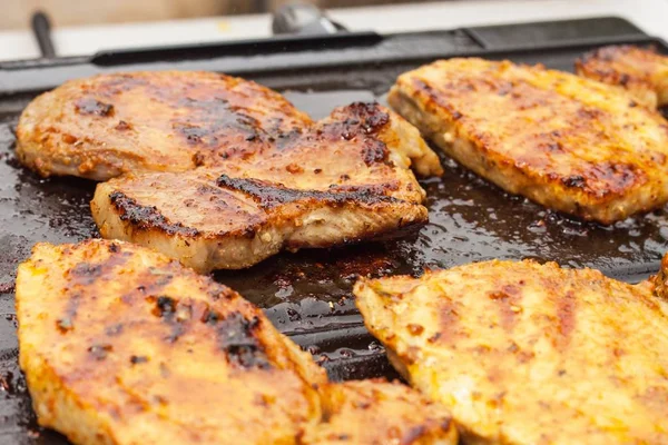 Chicken and pork on electric grill. Summer barbecue. Close-up view. — Stock Photo, Image