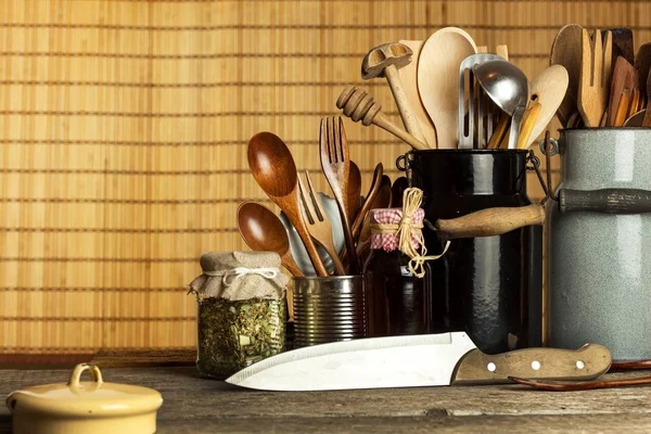 Kitchen tools on the table. Utensils for chefs. Old wooden spoon. — Stock Photo, Image