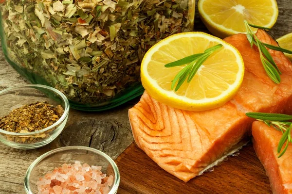 Frozen salmon on the kitchen table. Diet food. Home cooking fish.