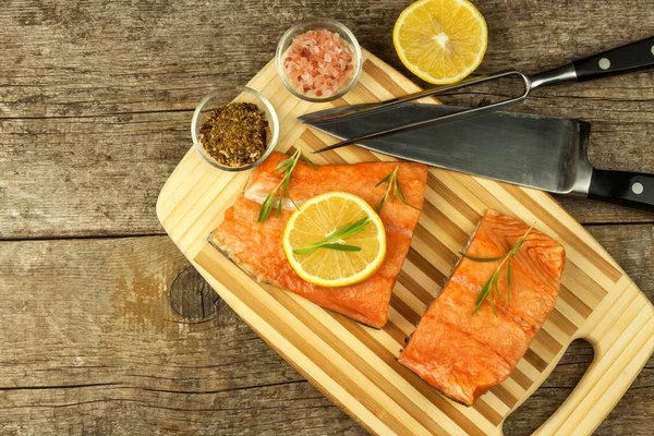 Frozen salmon on the kitchen table. Diet food. Home cooking fish.