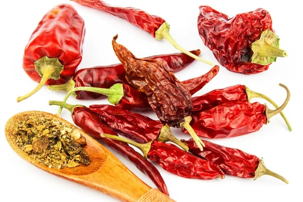 Dried chili peppers on a white background. Sales of exotic spices. Healthy raw food. — Stock Photo, Image