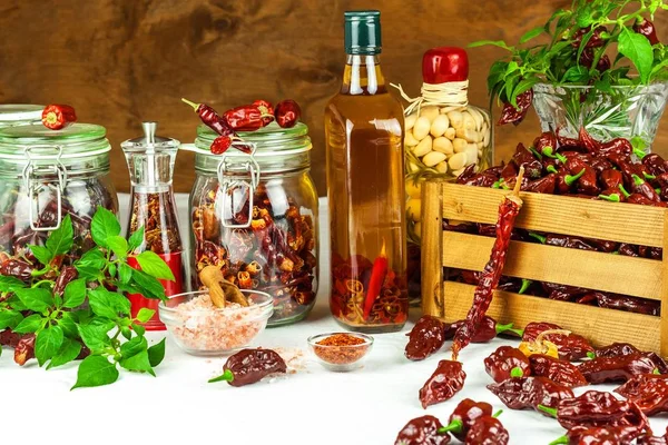 Harvest or chilli. Chili (Bhut Jolokia Chocolate) in a wooden crate. Preparation for drying. Spicy food. Sale of spices. — Stock Photo, Image