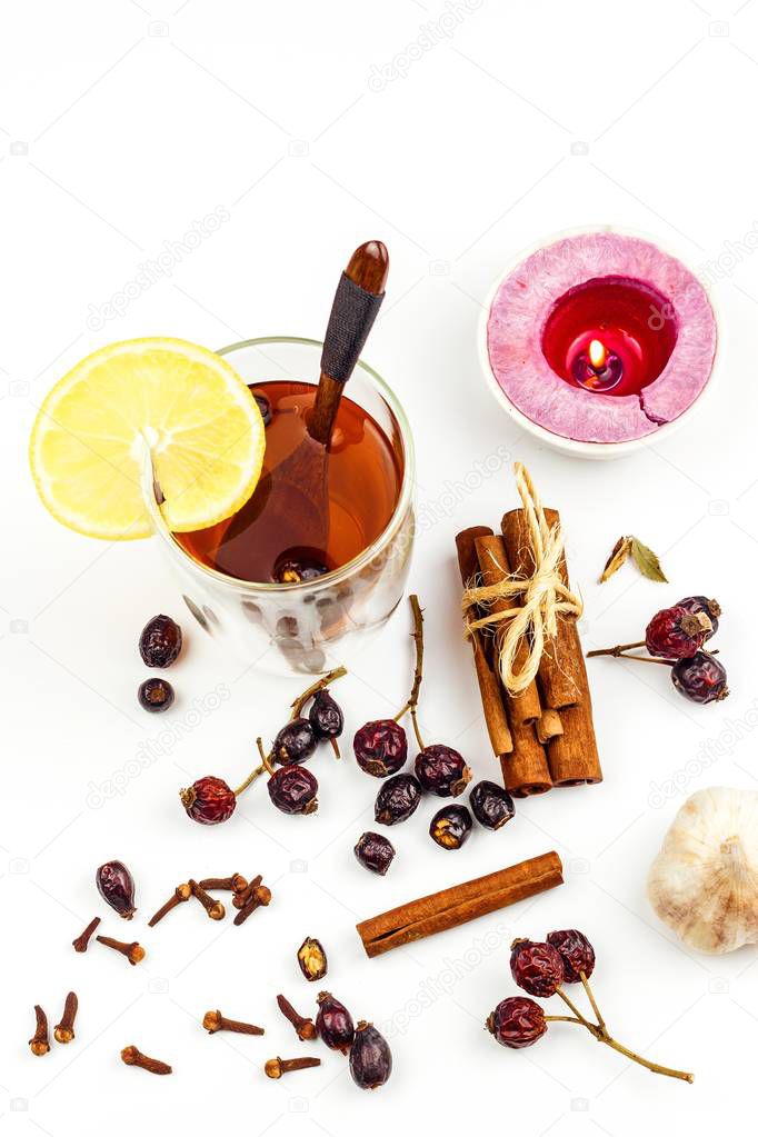 Rosehip tea. Alternative treatment for colds and flu. Dried rosehip. Glass with rosehip tea. Treatment of chills. Medicinal plants.