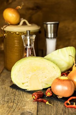 White cabbage on kitchen table. Homemade pickled vegetables. Vegetarian food. Healthy fermented vegetables. Farm life.
