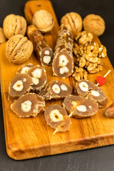 Churchkhela or Churchkela, the traditional Georgian homemade sweets with nuts. Sweet food. Traditional folk food. — Stock Photo, Image