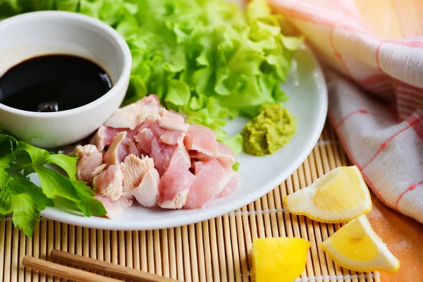 Sashimi raw chicken on white plate with wasabi sauce and vegetab — Stock Photo, Image