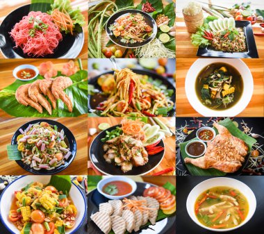 Yemek masasında servis edilen Tayland yemeği ve papaya salatası.