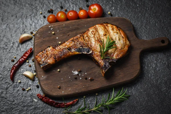 Grilled pork chop meat on black background - Pork chops steak wi — Stock Photo, Image