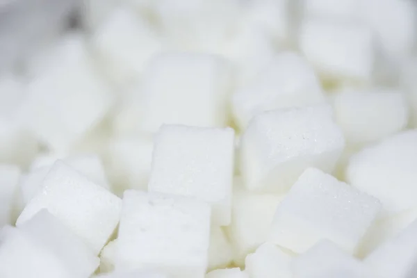 Close up of white sugar, top view / Sugar cubes texture backgro — стоковое фото