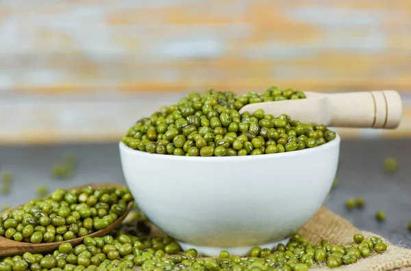 Mung beans on bowl agricultural products on the sack - dry green — ストック写真