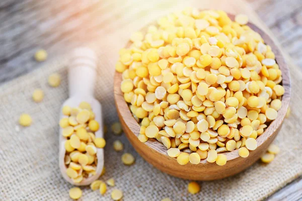 Soybean in a wooden bowl agricultural products on the sack backg — Stock Photo, Image