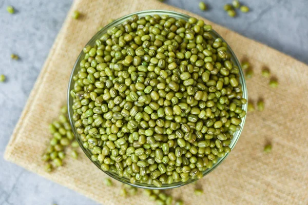 Green mung beans in bowl on gray background - Mung bean seed cer