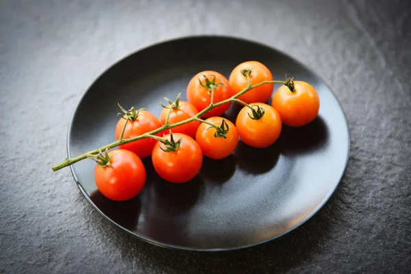 Ripe red tomato vine for cooked food on the table - Branch of fr