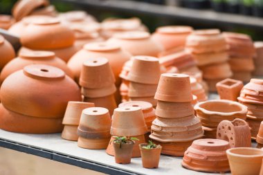 Clay flowerpot in the nursery plant tree / Terracotta pots for garden plants and flowers decorative flower pots and vases various sizes
