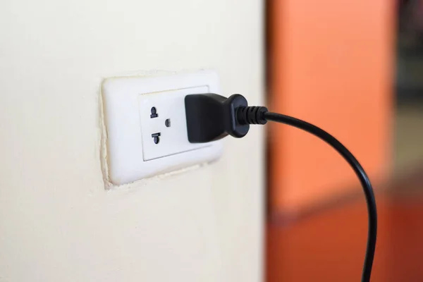 Home Outlet Plug Plugging Socket Wall Black Power Cord Cable — стоковое фото