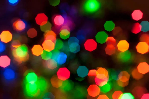 Ragyogó és ünnepi színes fény körök létre a kamera — Stock Fotó