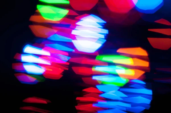 Gloeiende en feestelijke gekleurde lichte cirkels gemaakt van in camera — Stockfoto