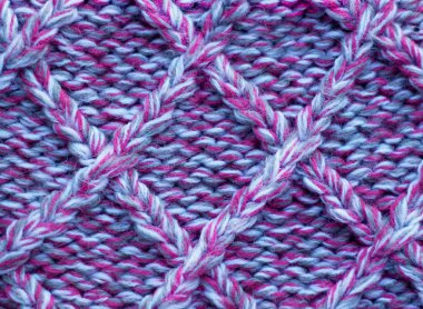 Knitting  in pink and gray melange.Knitted background. Knitted t