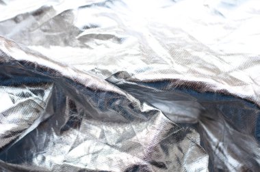 Background from crumpled silver fabric.