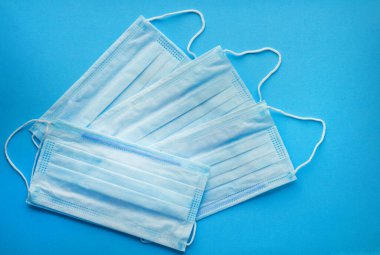 Surgical protective masks on a blue background. Blue medical mas