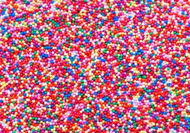 Abstract colorful sugar balls background.Used to decorate baking and sweets. Rainbow-colored sugar chip clipart