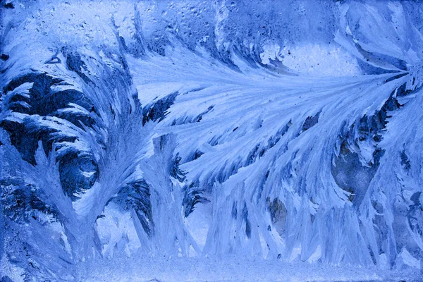 Frost on the frozen window. classic blue Royalty Free Stock Images