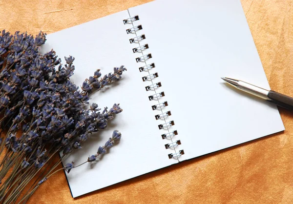 dry lavender and empty notebook