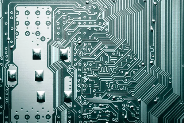 Blauw elektronisch moederbord circuit close-up macro achtergrond. — Stockfoto