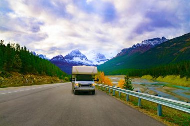Summer Road Trip In Recreational Vehicle Motorhome In Mountain Landscape clipart