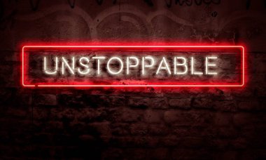 Inspiration Art On Wall Light Neon Sign At Night Unstoppable Strength Concept clipart