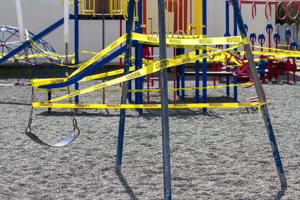 Single Swing Caution Taped Playground Swing Set Covid Pandemic — Stock Photo, Image