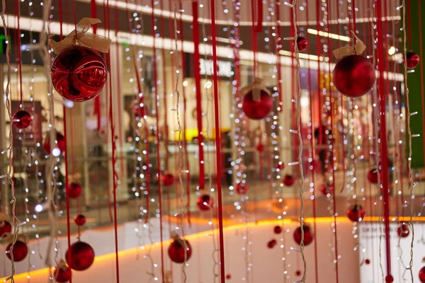 Christmas red balls with summer and garlands is decoratively decorated to decorate the market