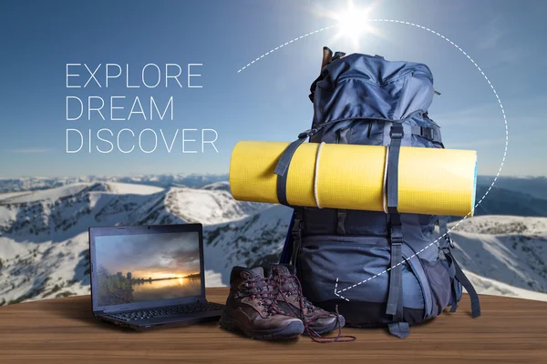 Backpack, trekking shoes, notebook, traveler equipment