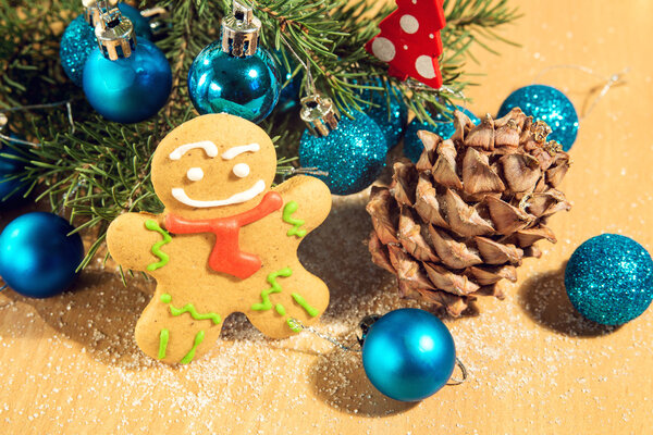 gingerbread man near Christmas tree with toys