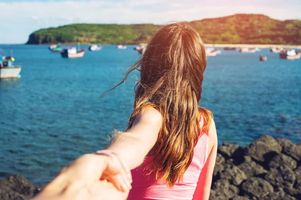 Woman with beautiful hair discovering jungle holding boyfriend's hand. — Stock Photo, Image