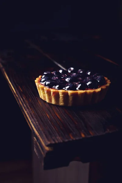 Mini Berry tart with blueberries on a wooden table — Stock Photo, Image