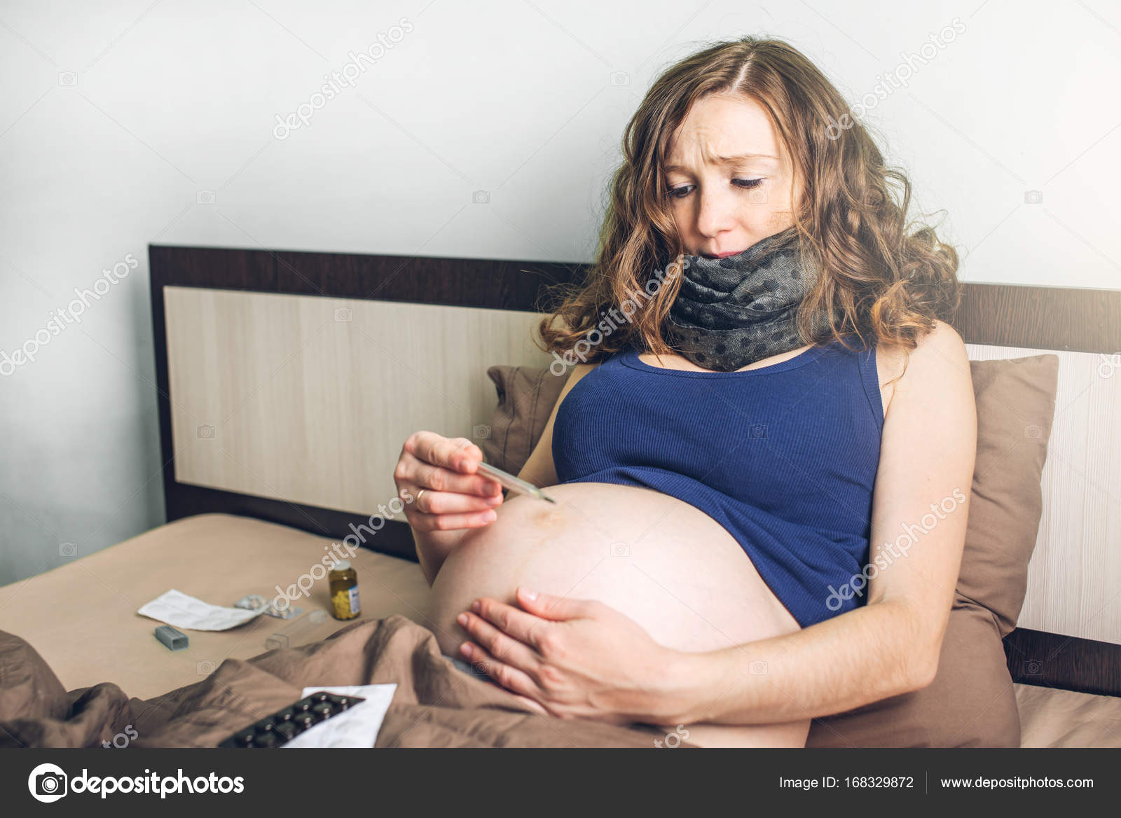 Pregnant Woman In Bed With Pills And A Thermometer Sick With The Flu Or A Cold Stock Photo Image By C Artoleshko 168329872