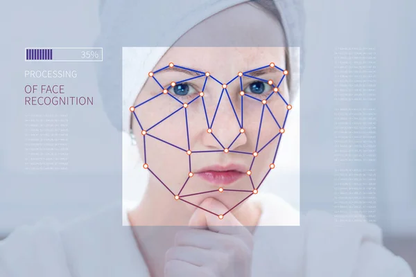 Biometric verification of a modern young woman. New technology of face recognition on polygonal grid