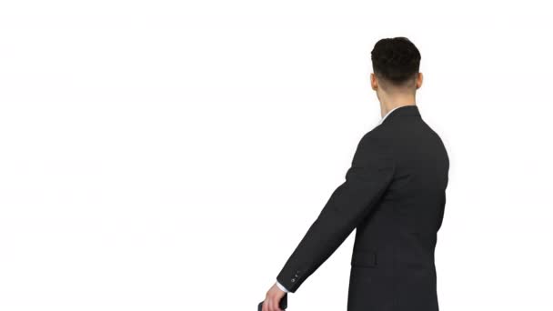 Young business man walking and taking a selfie on white background. — Stock Video