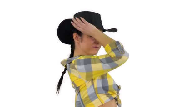 Young cowgirl dancing on white background. — Stock Video