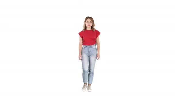 Casual woman walking and smiling on white background. — Stock Video