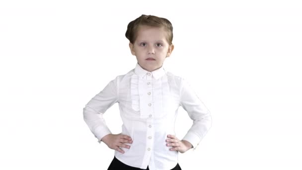 Little cute girl walking with hands on her hips on white background. — Stock Video