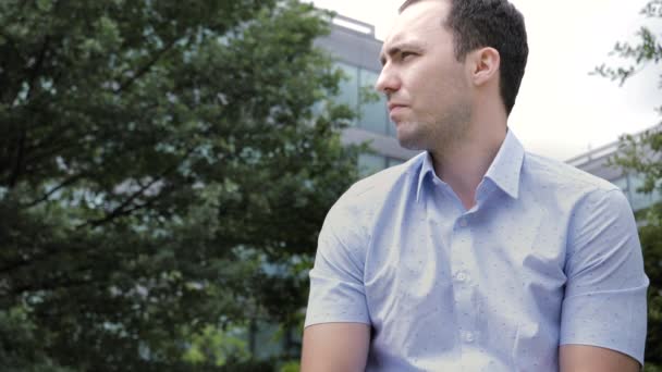 Depressed guy is alone in a park. — Stock Video