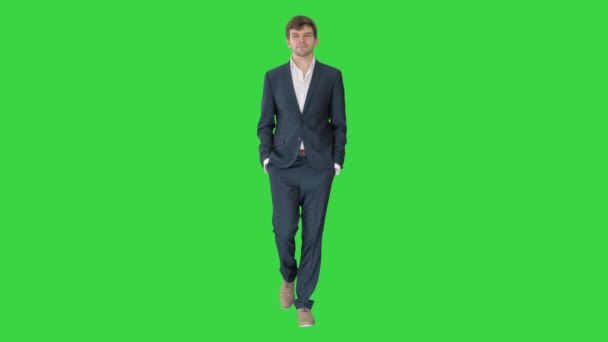 Handsome business man walking forward on a Green Screen, Chroma Key. — Stock Video