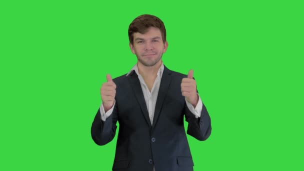 Young business man going thumbs up and ok gesture after on a Green Screen, Chroma Key. — Stock Video