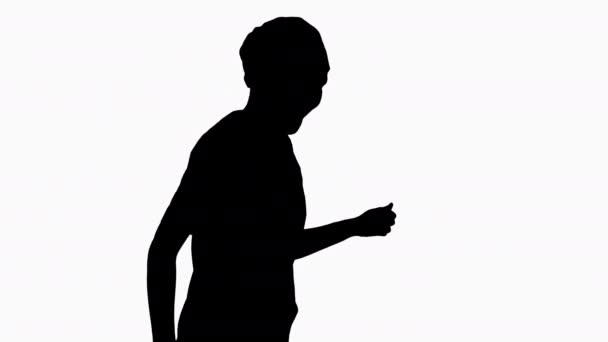 Silhouette Girl läkare dansar och går. — Stockvideo