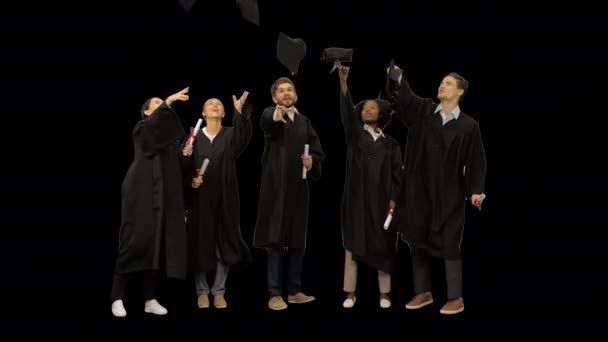 High school graduates tossing up hats, Alpha Channel — Stock Video