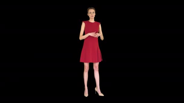 Pretty woman in a dress talking and making gestures like in weather forecast, Alpha Channel — Stock Video