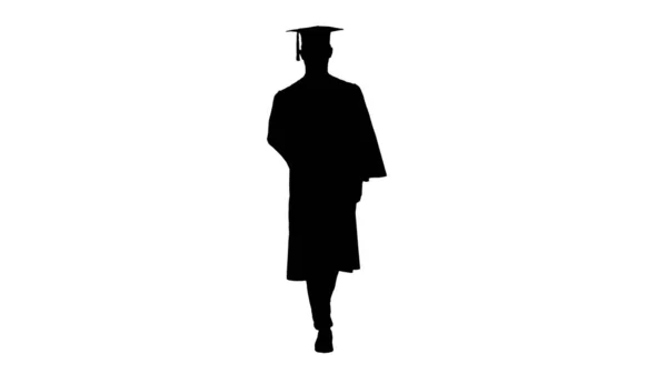 Silhouette Young man with graduation gown walking in medical mas — Stock Photo, Image