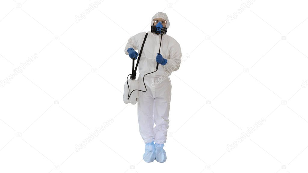 Man in a protective suit and mask holding a disinfectant ready t
